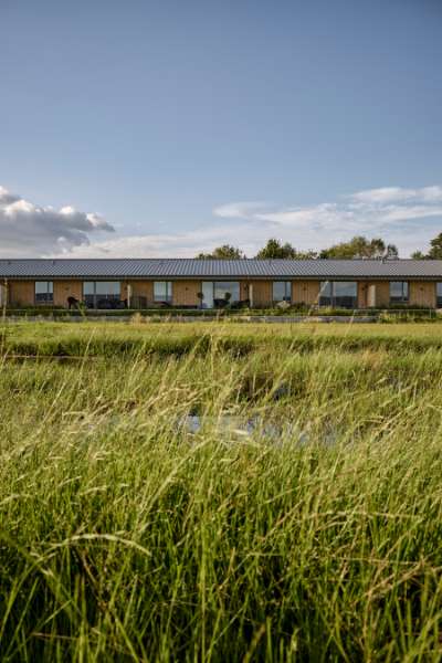 Past and future meet in steel-clad terraced houses with history in the backyard, Jernaldervej 8, 8600 Silkeborg, Denmark